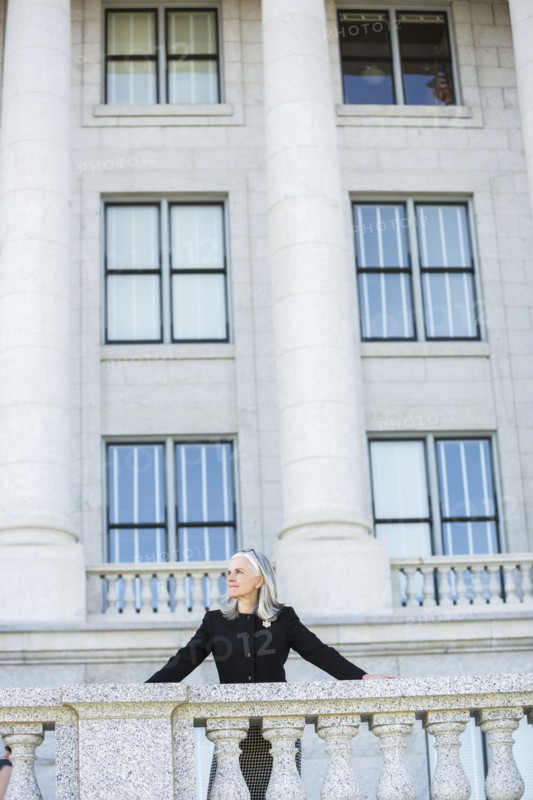 Caucasian businesswoman standing outside courthouse