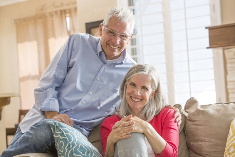 Caucasian couple sitting on sofa