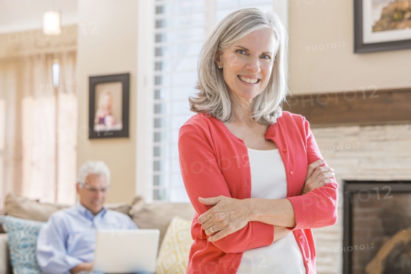Caucasian woman standing in living room