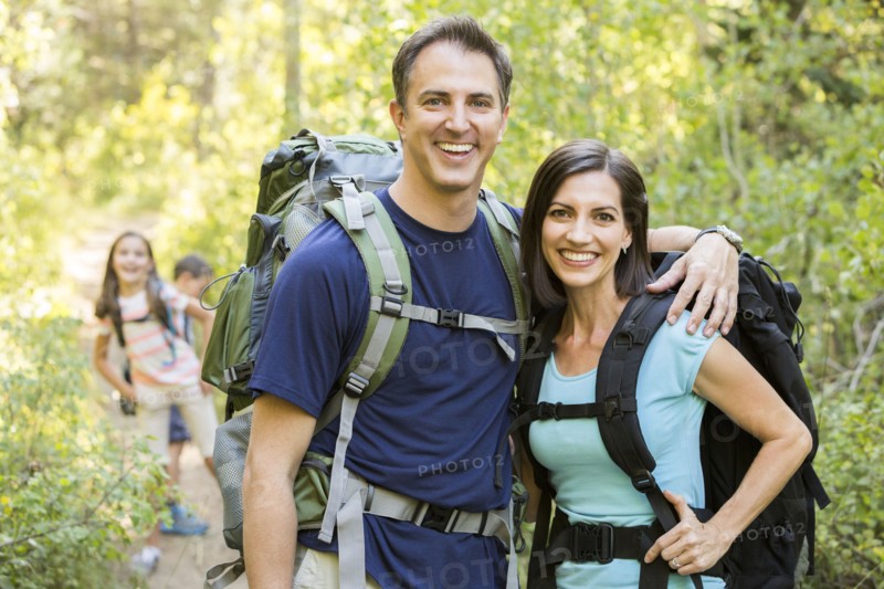 Caucasian family hiking on path