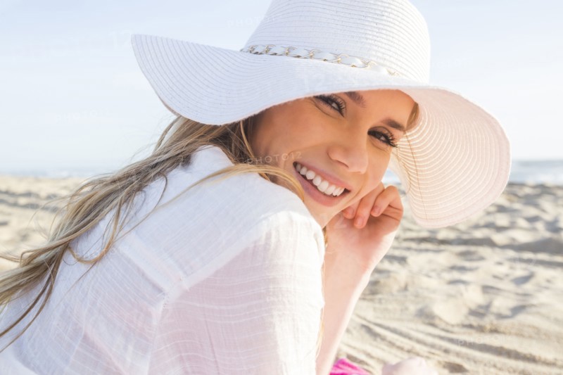Caucasian woman laying on beach