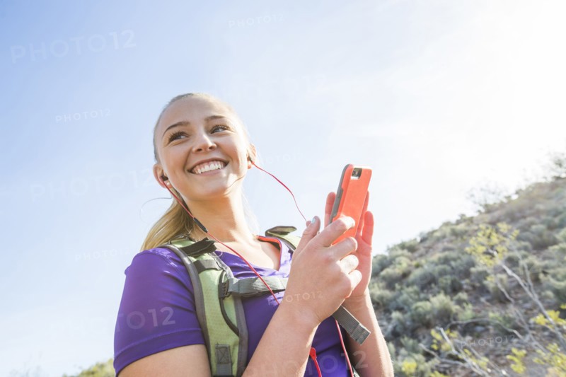 Caucasian woman using cell phone outdoors