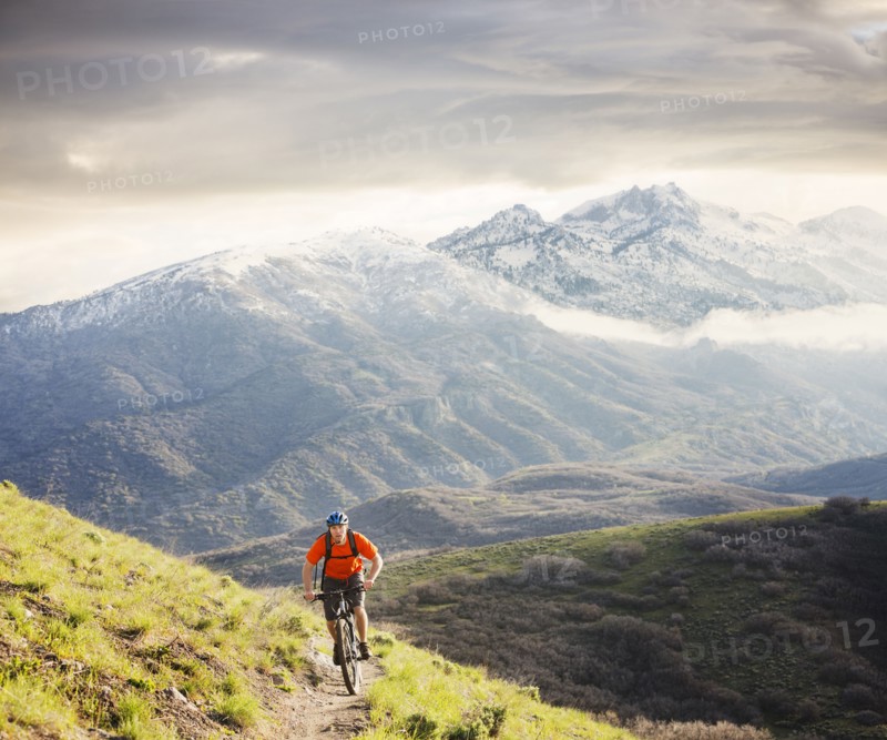 Caucasian man riding mountain bike
