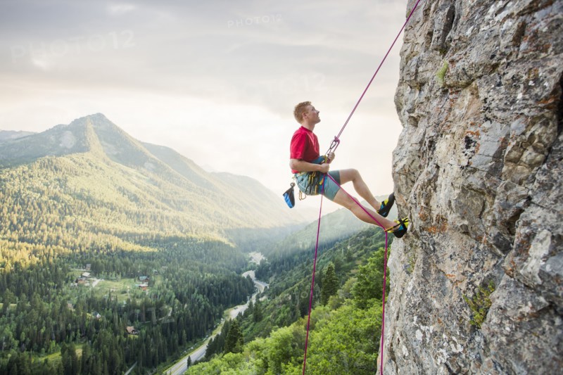 Caucasian man rock climbing