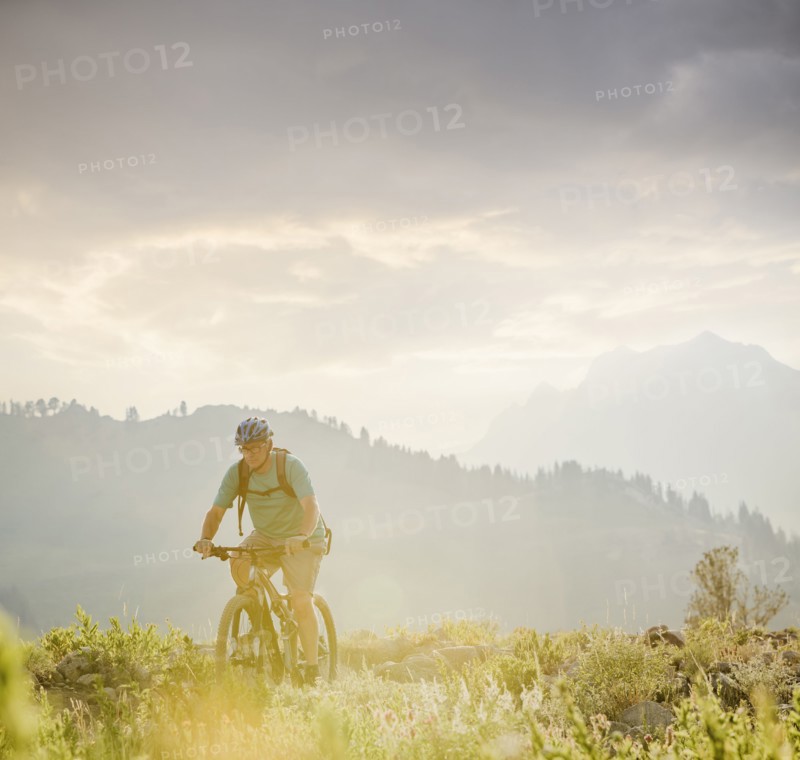 Caucasian man riding mountain bike