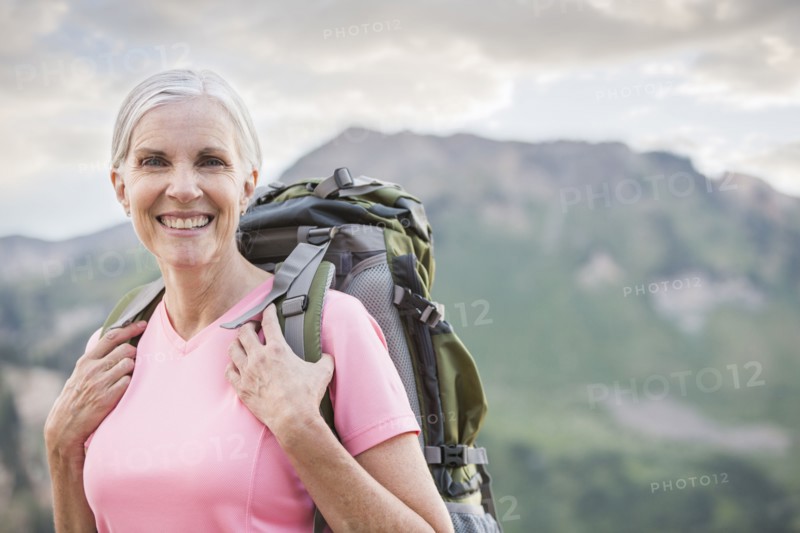 Caucasian woman hiking on mountain