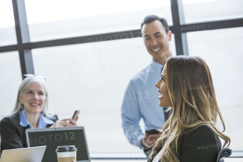 Business people smiling in meeting