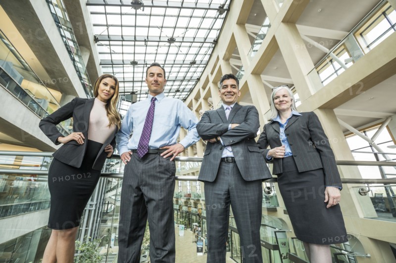 Portrait of smiling business people in lobby