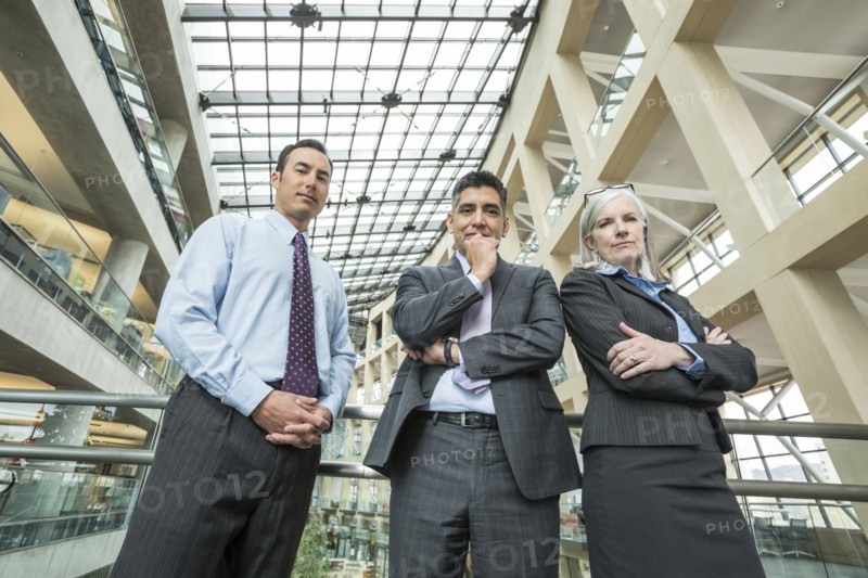 Portrait of serious business people in lobby