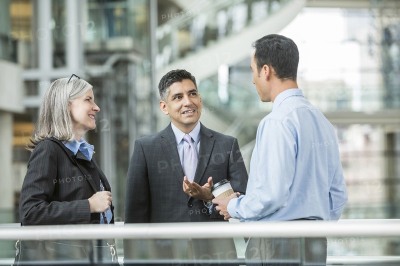 Business people talking in lobby