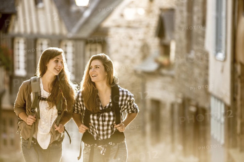 Caucasian women backpacking in city