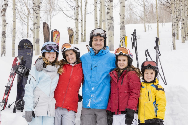 Portrait of smiling Caucasian family on skiing vacation