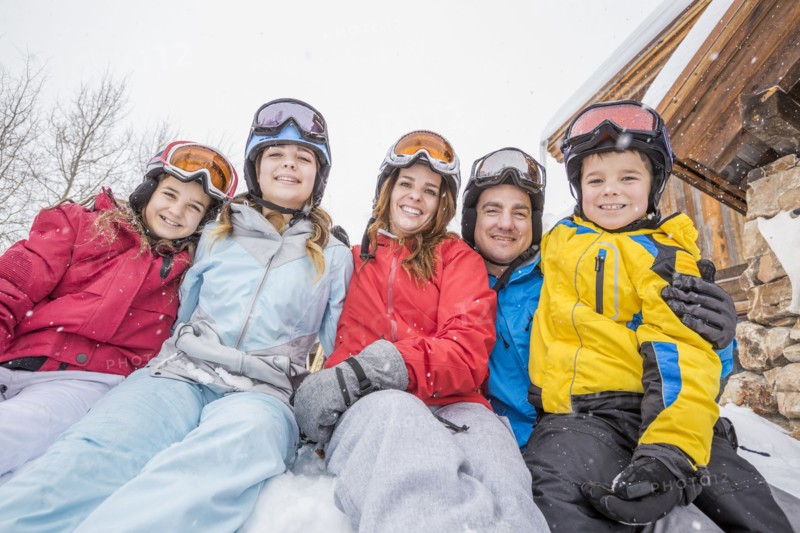 Portrait of smiling Caucasian family on winter vacation