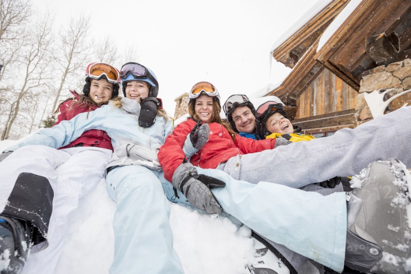 Portrait of smiling Caucasian family on winter vacation