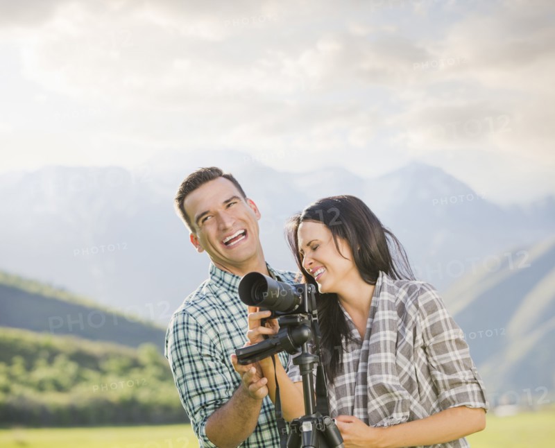 Couple with camera laughing