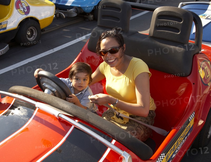 Mother and son in bumper car