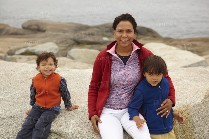 Mother and boys enjoying the beach