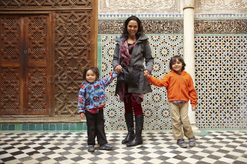 Mother and sons in Moroccan building
