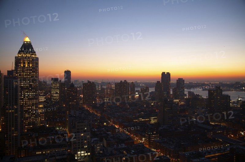 Sunset and illuminated cityscape