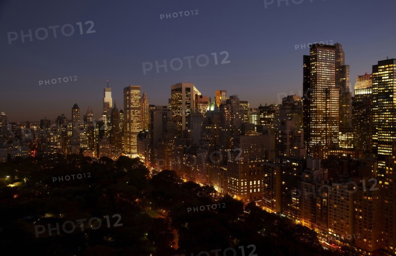 Sunset and illuminated cityscape