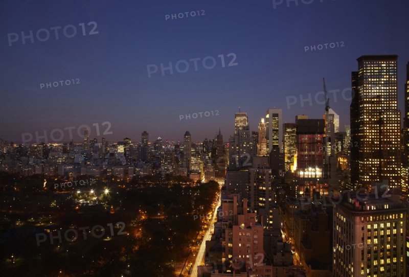 Sunset and illuminated cityscape