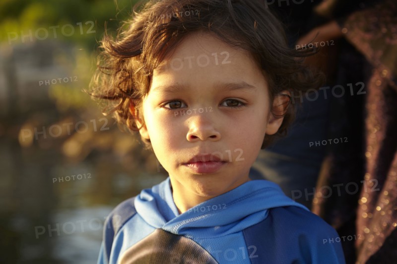 Mixed race boy with serious expression