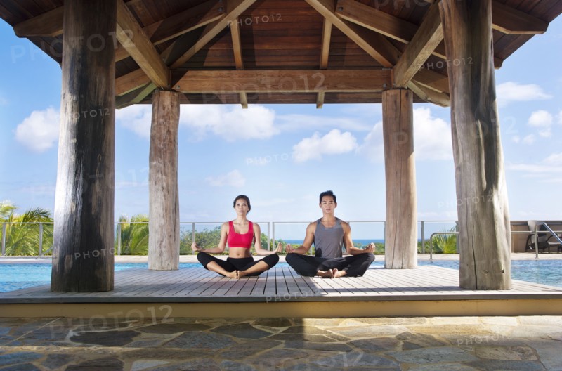 Couple practicing yoga together