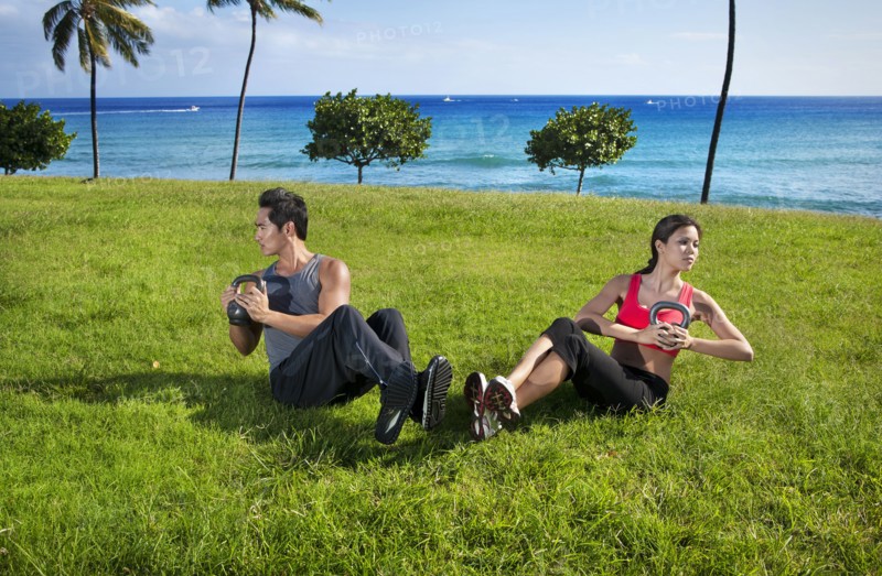 Couple exercising together at waterfront