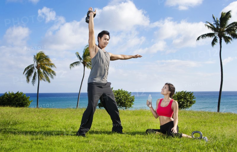 Couple exercising together at waterfront