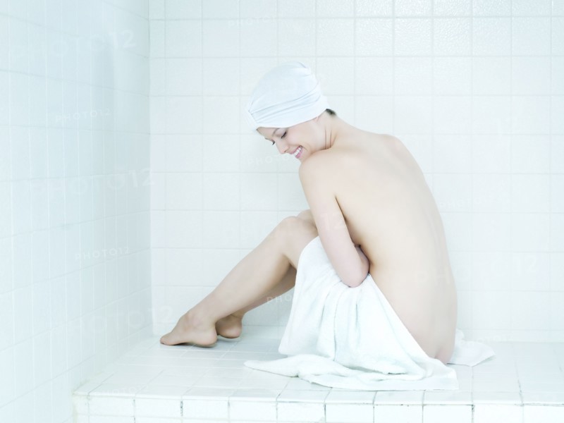 Caucasian woman wrapped in a towel