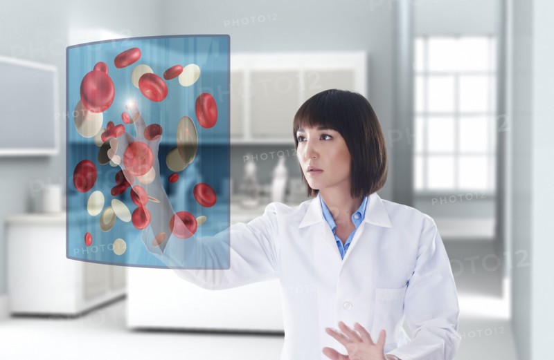 Mixed race doctor using digital display in doctor's office