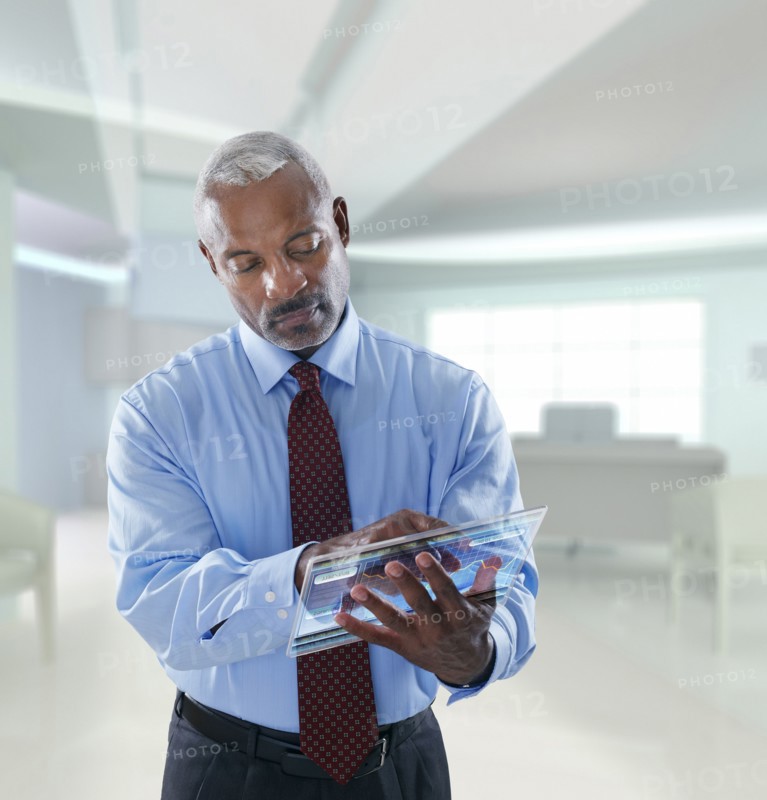 Black businessman using digital tablet in a lab