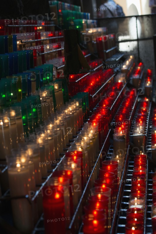 Lit candles in church