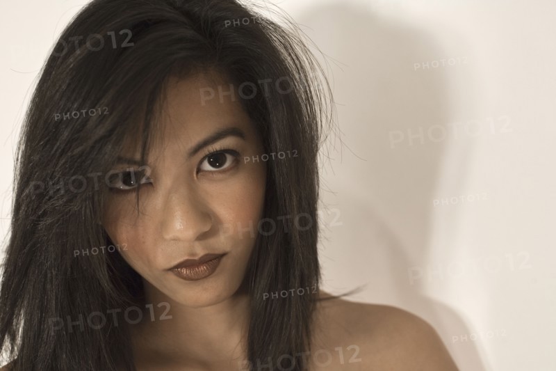 Asian woman with bare shoulders