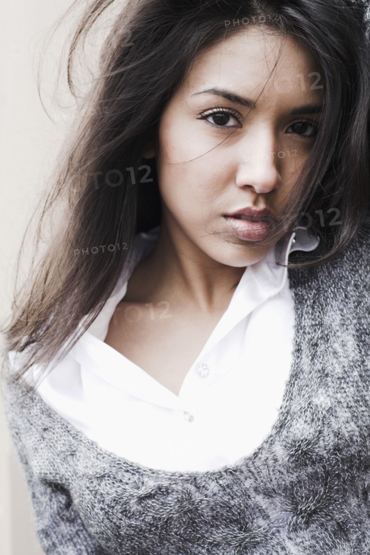 Middle Eastern woman with hair blowing