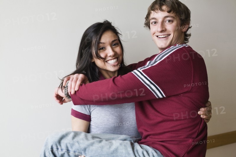 Middle Eastern woman holding boyfriend