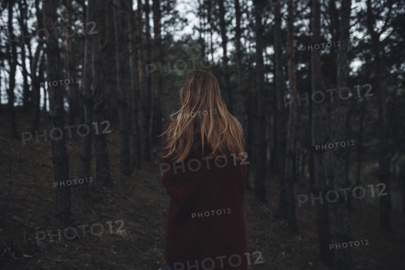 Caucasian woman standing in forest