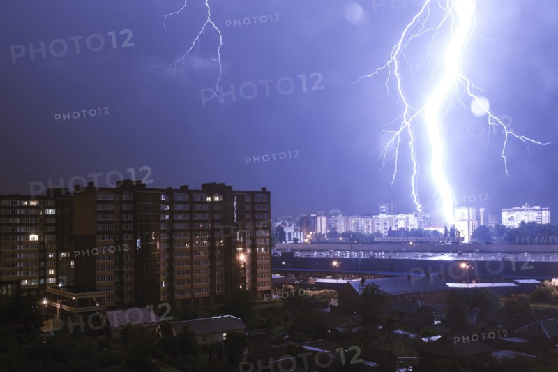 Lightning striking city at night