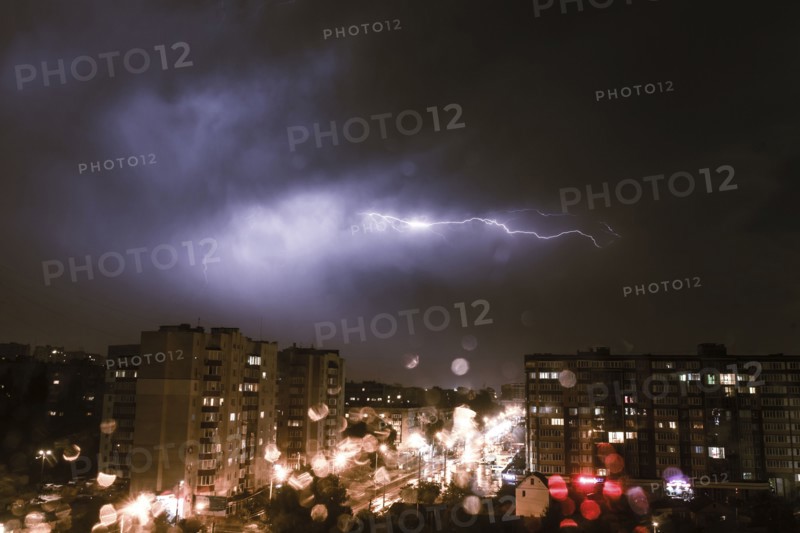 Lightning striking city at night