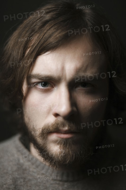 Close up of serious Caucasian man with beard
