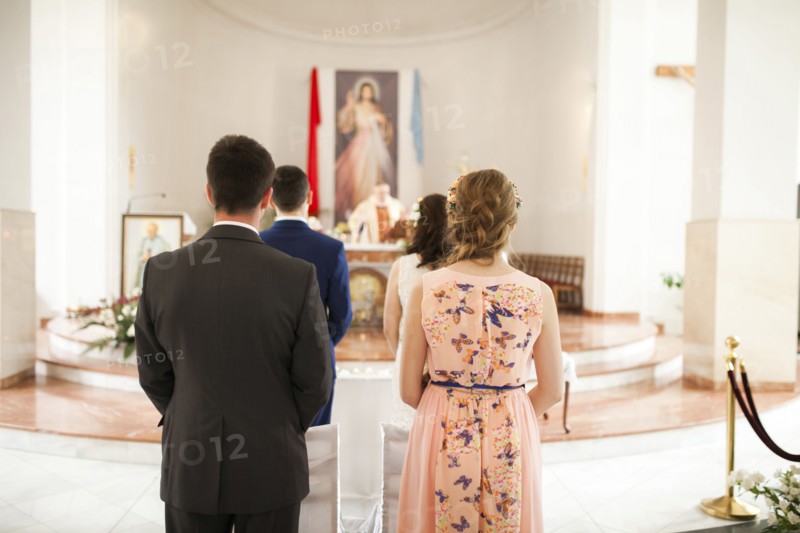 Couples waiting in church