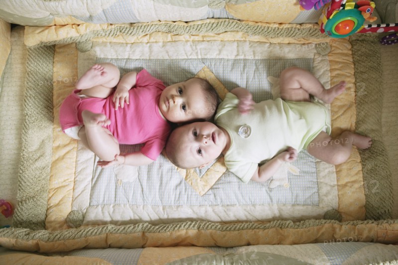 High angle view of two babies on blanket