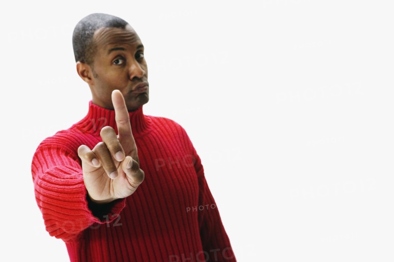 African man holding index finger up and pursing lips