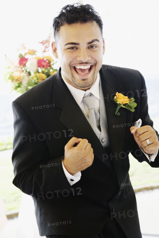 Hispanic man wearing tuxedo