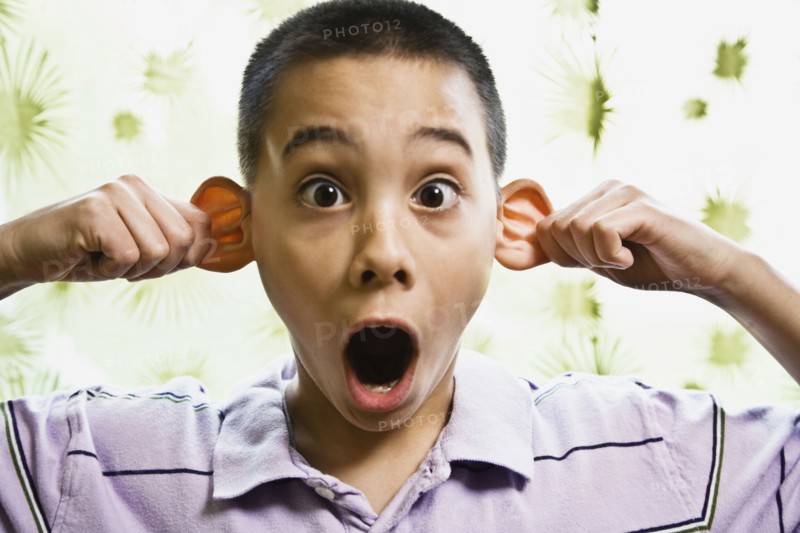 Asian boy pulling on ears