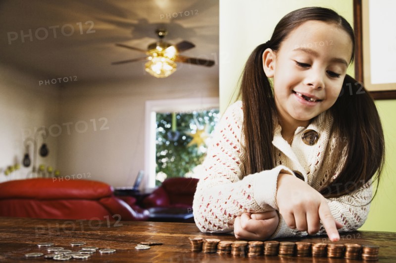 Asian girl counting coins