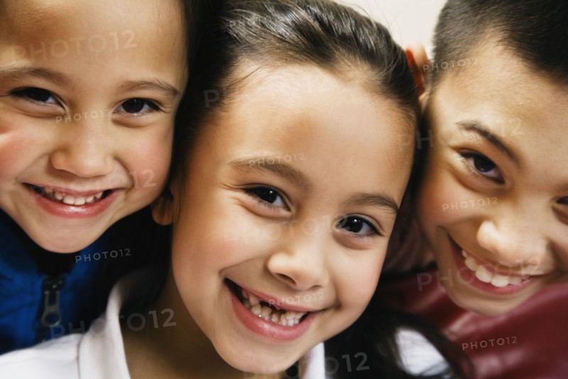 Close up of Asian siblings smiling
