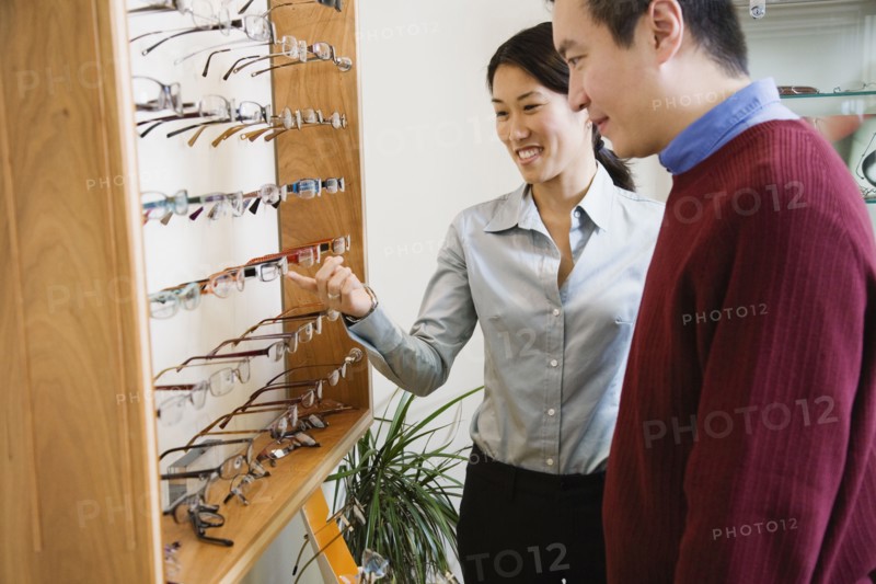Asian couple shopping for eyeglasses