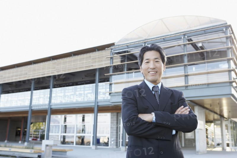 Portrait of Asian businessman with arms crossed