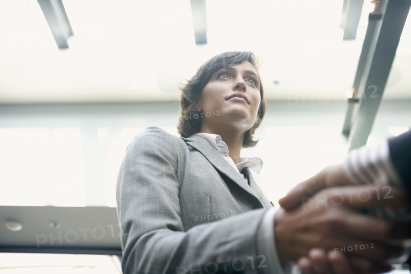 Hispanic businesswoman shaking hands